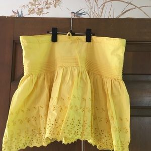 Yellow eyelet mini skirt